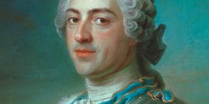 louis xv pastel portrait, he looks slightly over his shoulder to face the viewer and wears an ornate metal, blue, white, and red military uniform