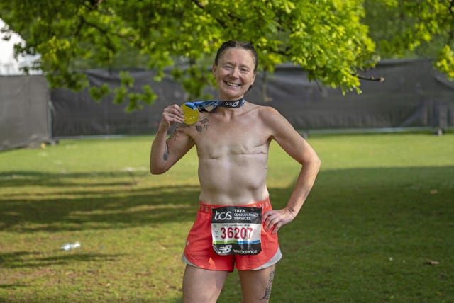 runner celebrating with a medal after a race
