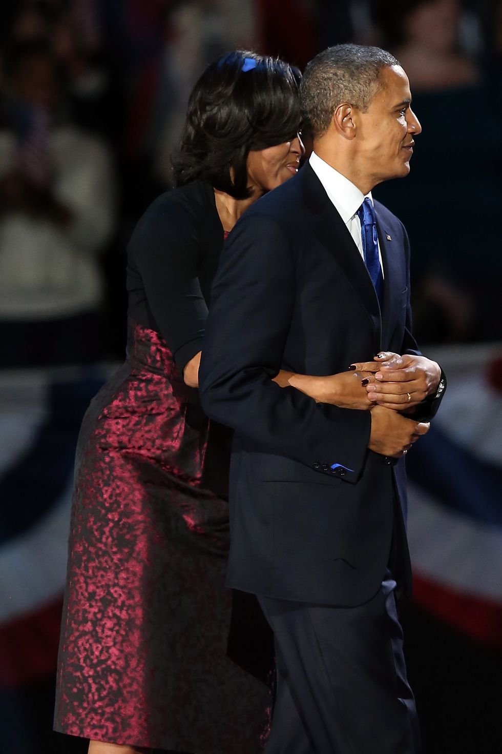 chicago, il   november 06  us president barack obama stands on stage with first lady michelle obama after his victory speech on election night at mccormick place november 6, 2012 in chicago, illinois obama won reelection against republican candidate, former massachusetts governor mitt romney  photo by scott olsongetty images