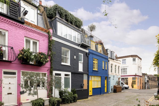 Authentic street scene of St Luke's Mews capturing the charming pastel-colored homes
