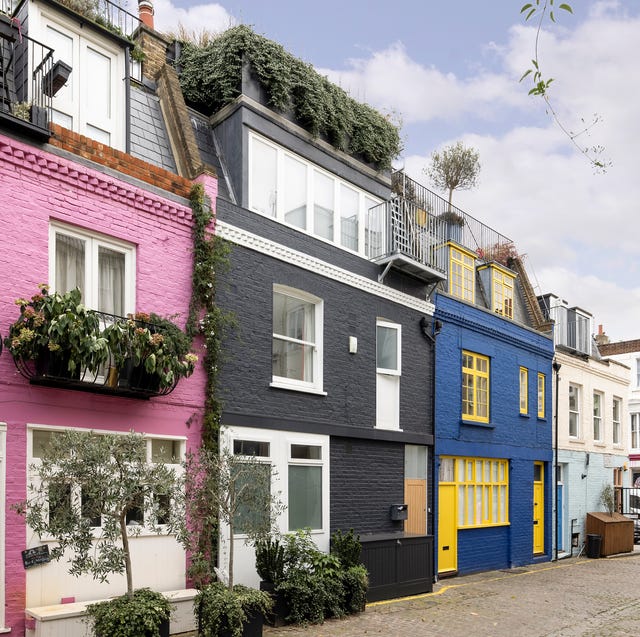 Authentic street scene of St Luke's Mews capturing the charming pastel-colored homes