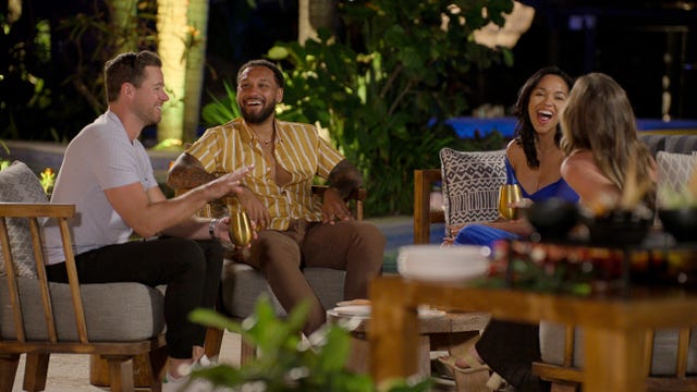 group of love is blind contestants in a relaxed conversation setting