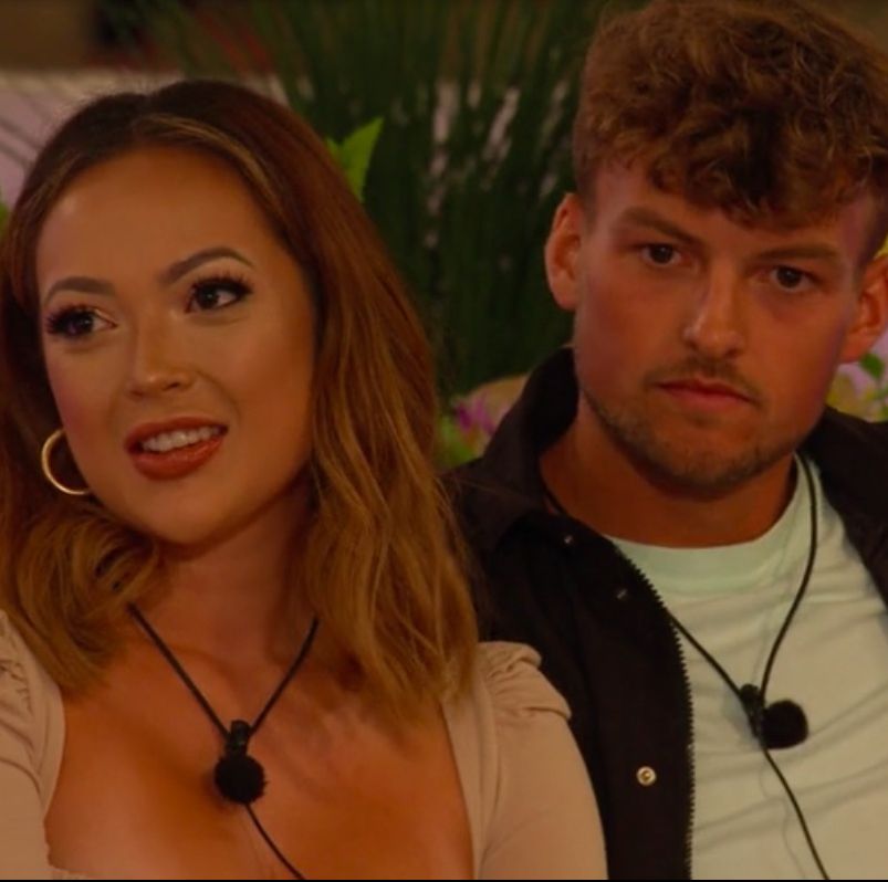 love island's sharon and hugo sitting together in the garden