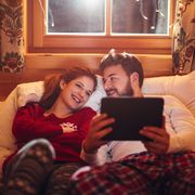 couple watching movie on ipad in bed