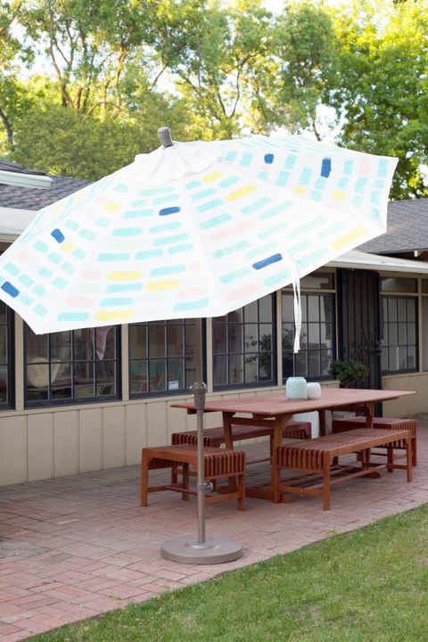 painted patio umbrella in backyard