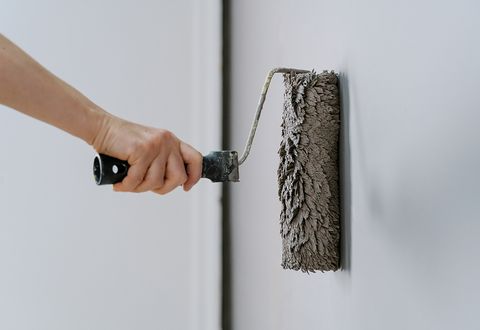 paint roller covered in gray paint
