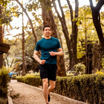 low angle photo of senior athlete running