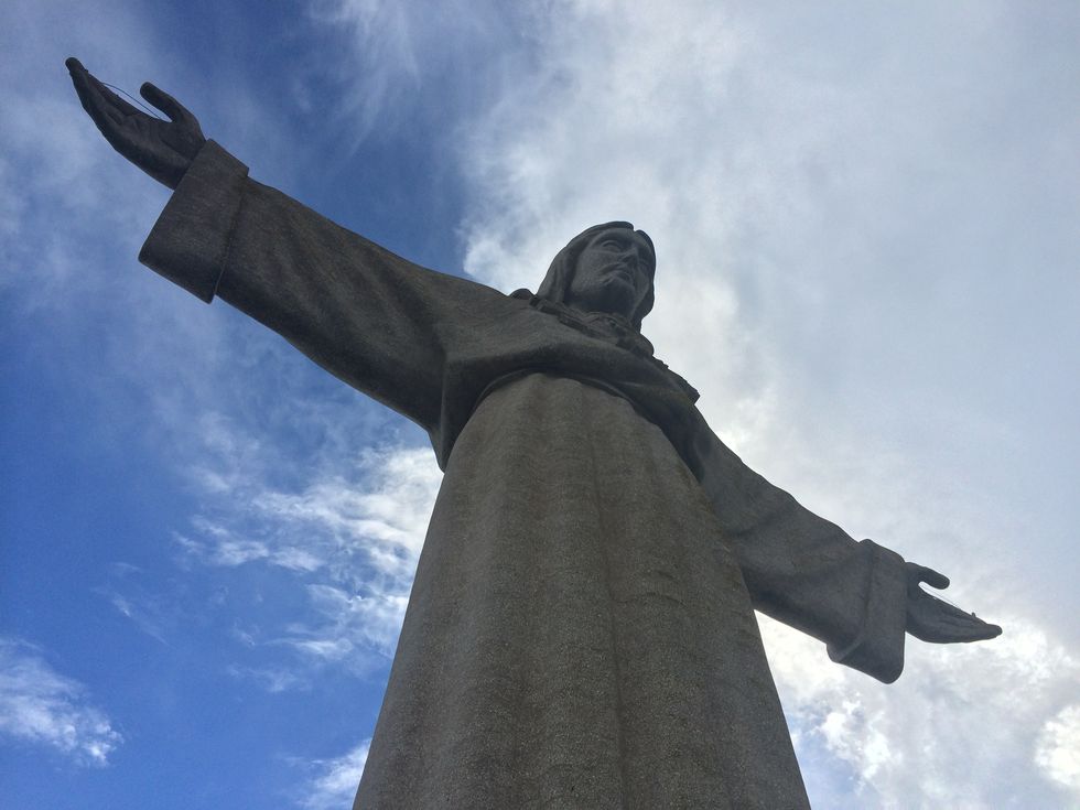 Low Angle View Of Christ The Redeemer Against Cloudy Sky