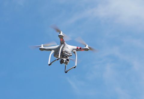 Low Angle View Of Drone Flying Against Sky