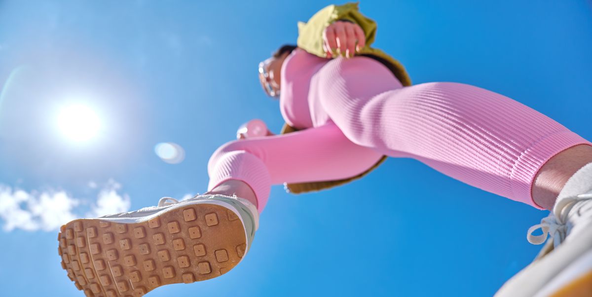 https://hips.hearstapps.com/hmg-prod/images/low-angle-view-of-fit-woman-wearing-pink-sports-royalty-free-image-1753474935.pjpeg?crop=1.00xw:0.752xh;0,0.0529xh&resize=1200:*