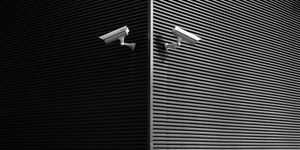 Low Angle View Of Security Cameras On Wall