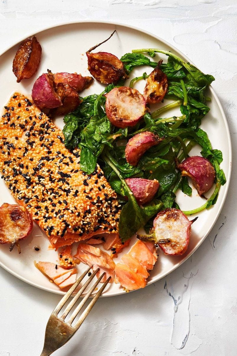 sesame crusted salmon with a side salad of roasted radishes and wilted spinach