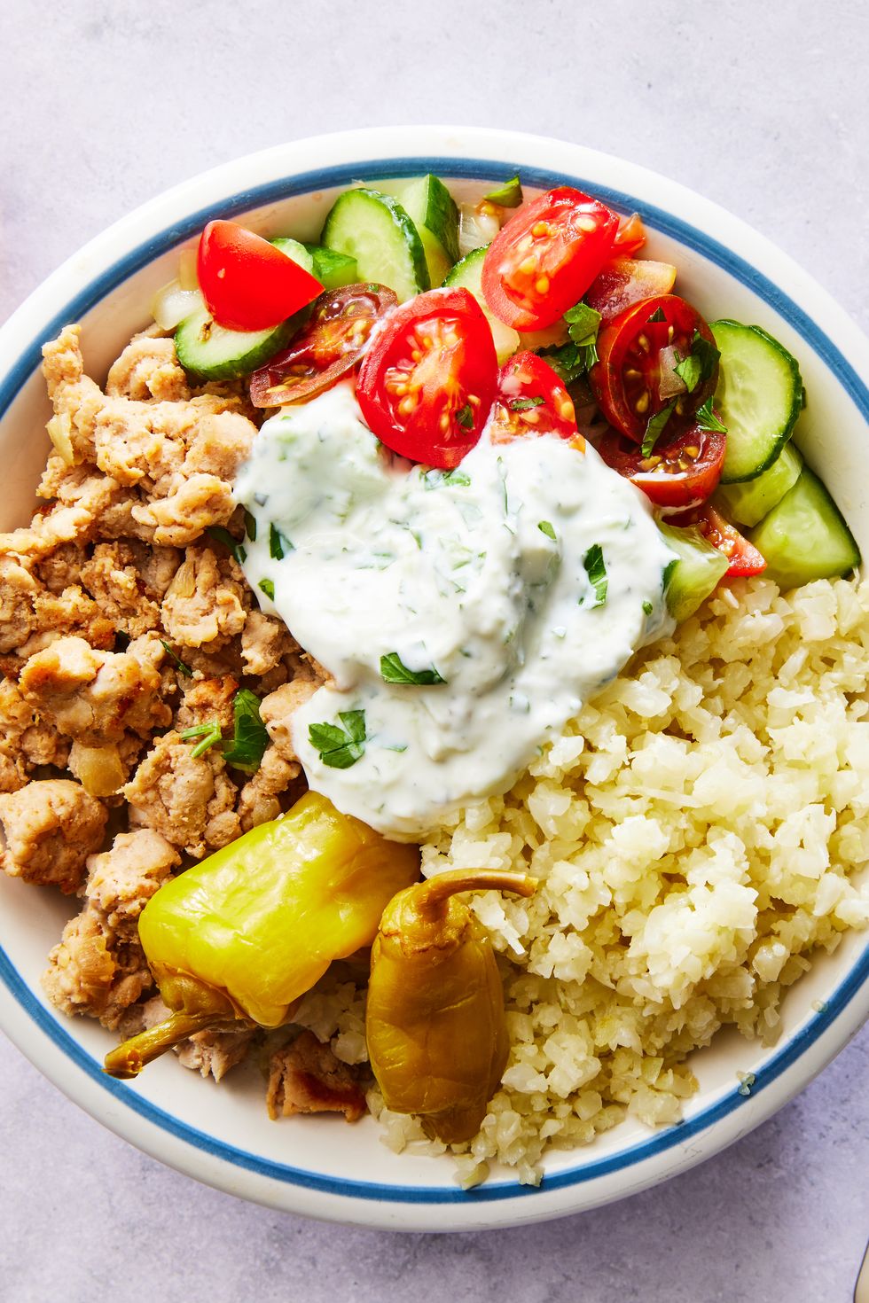ground turkey with cauliflower rice, cucumber salad, and tzatziki