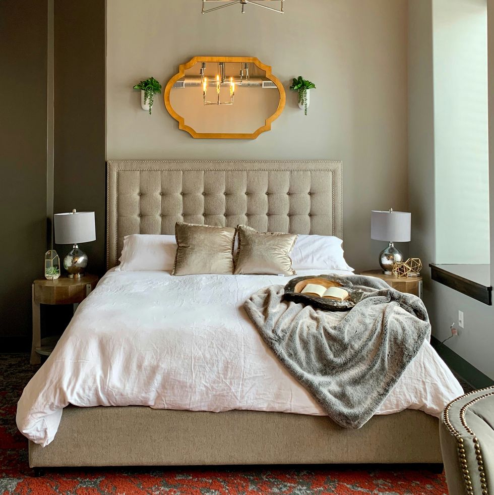 a bed with a large headboard