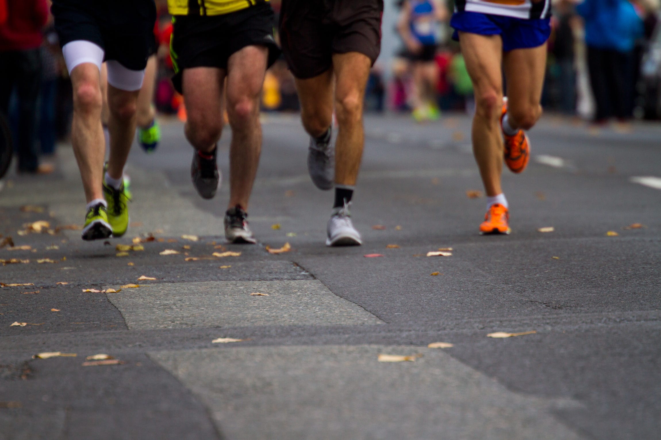 Low Section Of People Running On Street In Marathon