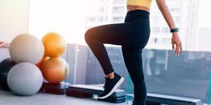low section of woman exercising at gym