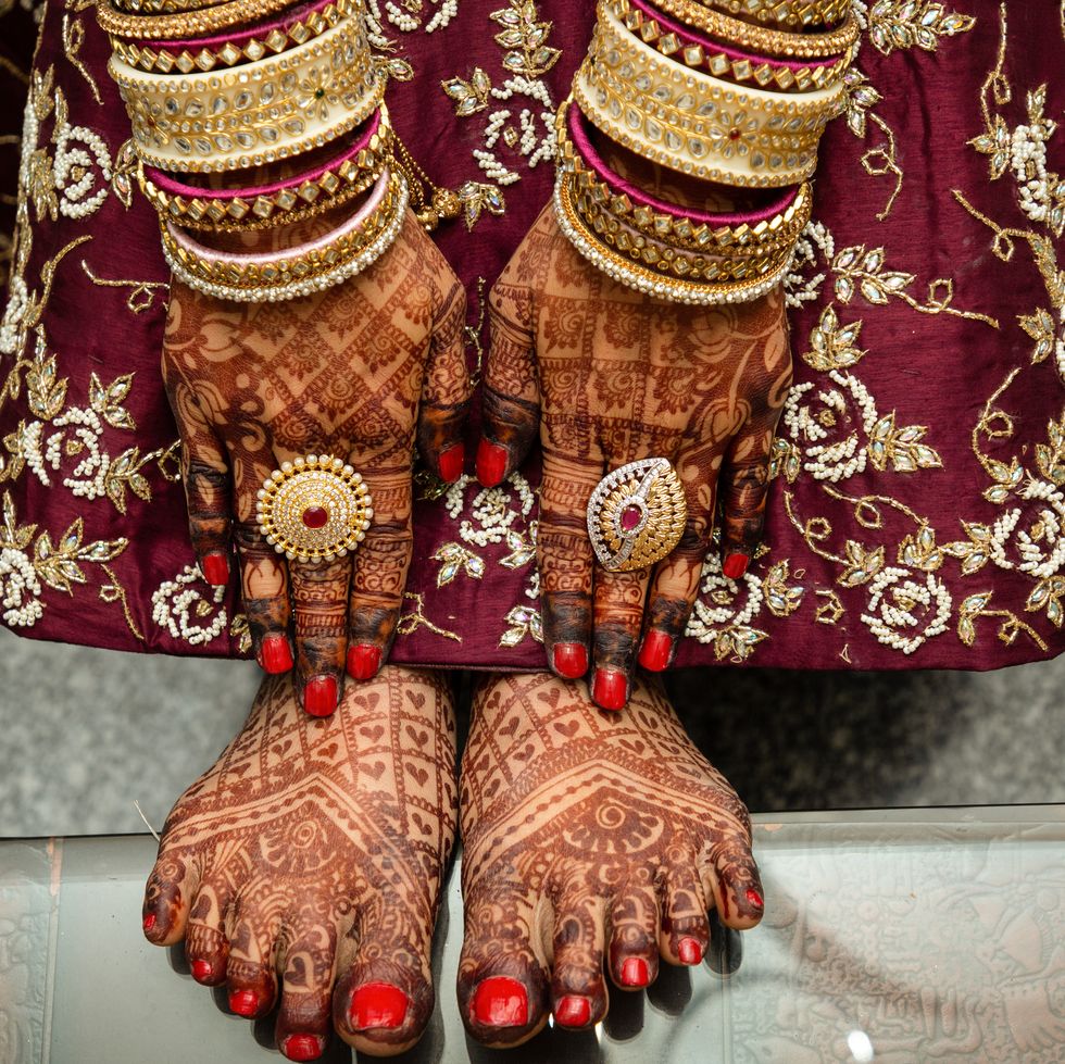 low section photography of bride with henna tattoo