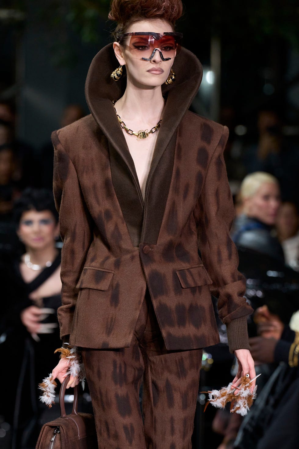 Model showcasing a stylish brown suit