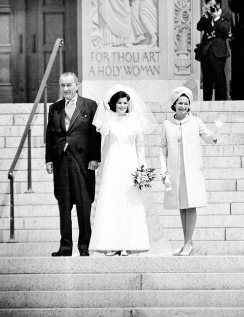 luci baines johnson flanked by president lyndon johnson and