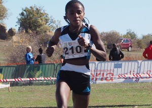 a person running on a grass field