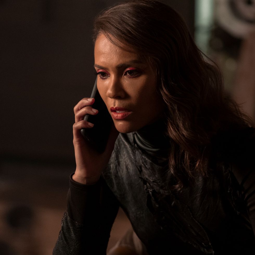 lesley ann brandt as maze, seen in a black top while holding a phone to her ear, in lucifer season 5
