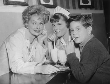 lucille ball enjoying drinks with her two children off set