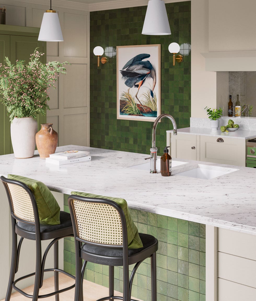 a green tiled kitchen with white quartz island and black and cane bar stools