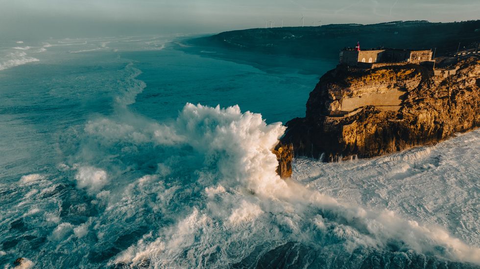 nazaré is a very popular surfing destination because of the very high breaking waves that form due to the presence of the underwater nazaré canyon the canyon increases and converges the incoming ocean swell which, in conjunction with the local water current, dramatically enlarges wave heights