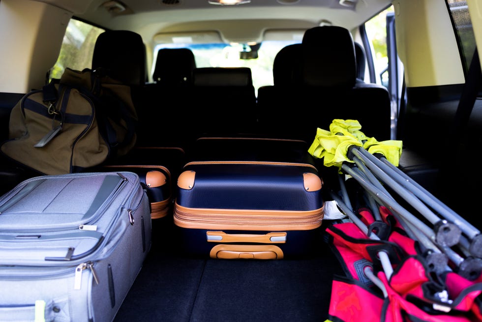luggage packed in trunk of car
