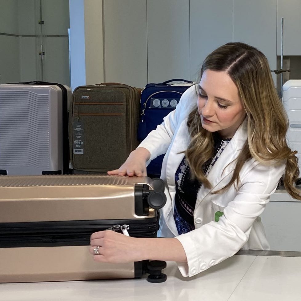 textiles lab executive director lexie sachs opening a piece of luggage