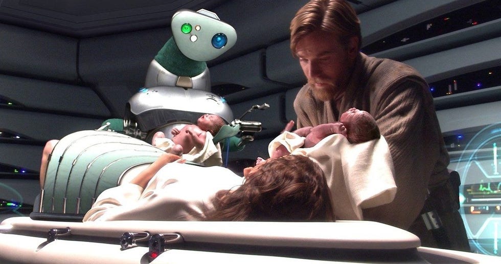 birth scene with a medical droid assisting and newborns involved