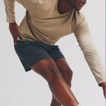 a male athlete stretching while a female athlete displays leggings on sale a male athlete stretching while a female athlete displays leggings on sale