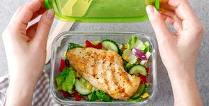lunch box of vegetable salad with grilled chicken breast