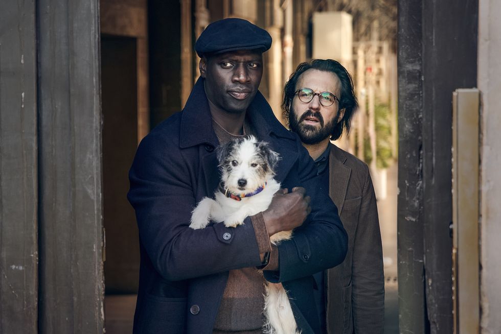 omar sy as assane diop with dog jaccuse in lupin