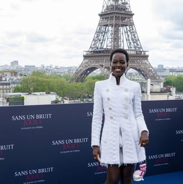 lupita nyongo wears a white chanel suit to the premiere of a quiet place day one