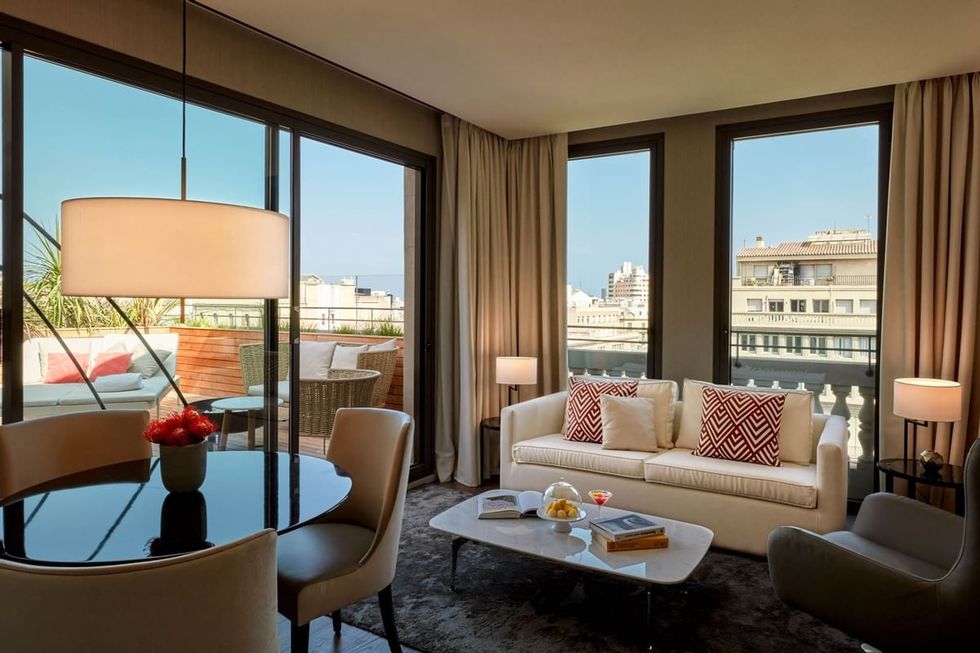 a suite living room with a view of the city