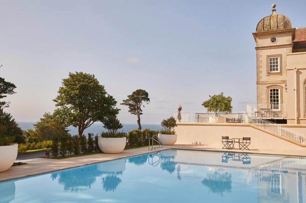 a pool with a building in the background