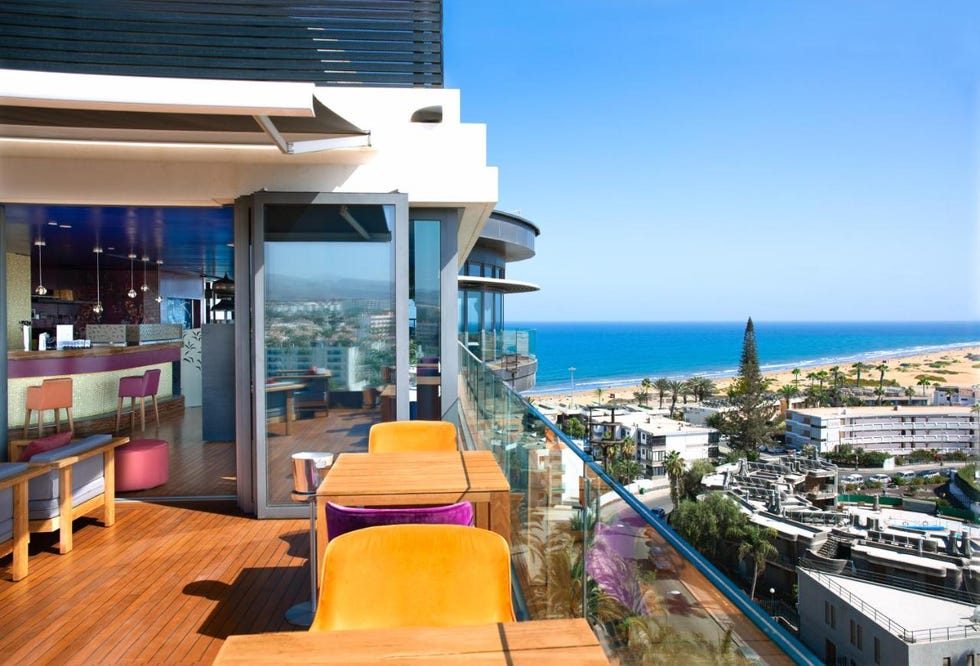 seating on the terrace at one of the bohemia suites and spa's bar overlooking the sea