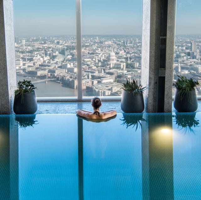 Luxury Hotels London - Shangri-La The Shard woman in shangrila the shard infinity pool overlooking london