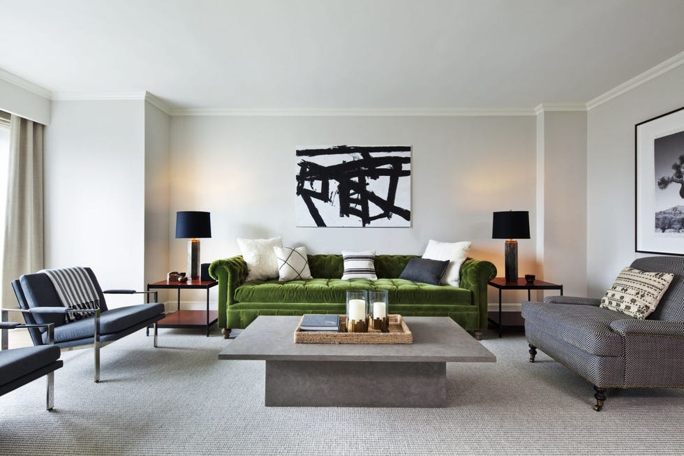 a living room with a green couch