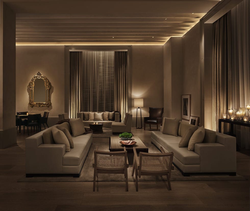 a dimly lit lobby area with seating