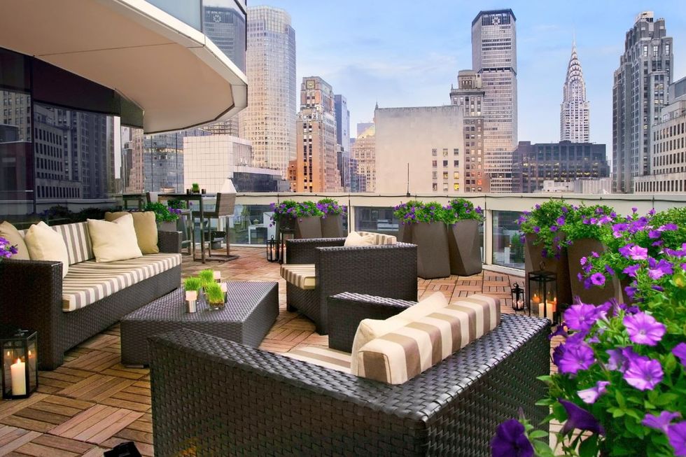 outdoor terrace with seating and views of new york