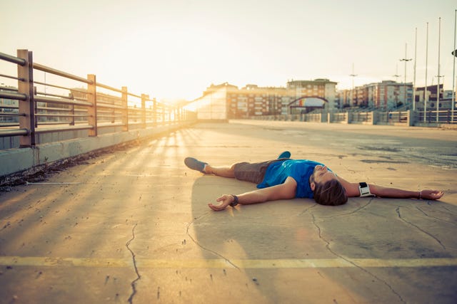 lying down on the floor exhausted after workout