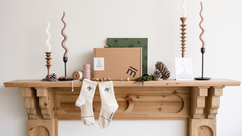 a wooden shelf with a box and a box on it