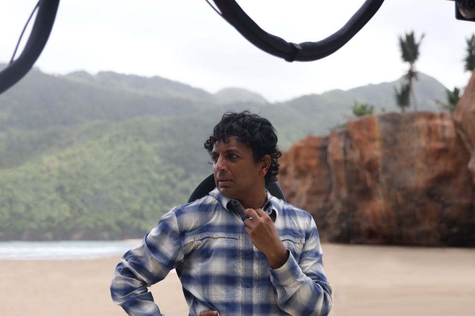 https://hips.hearstapps.com/hmg-prod/images/m-night-shyamalan-on-old-set-1624138191.jpg?crop=0.477xw:0.716xh;0.260xw,0.284xh&resize=980:*