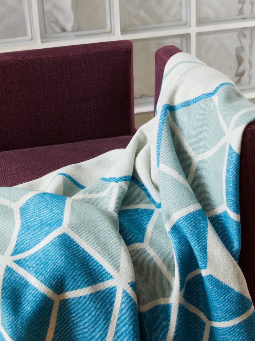 a pair of blue and white striped socks on a couch