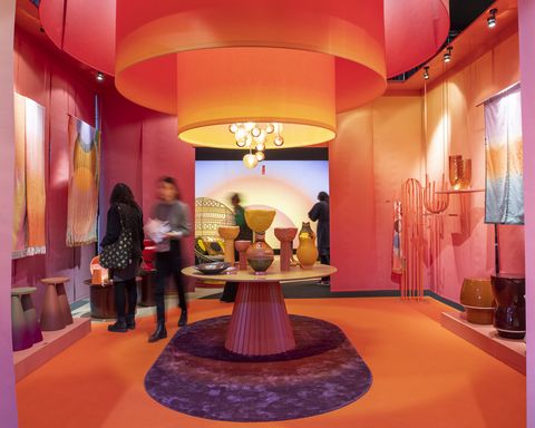a booth at maison objet with red and orange hues