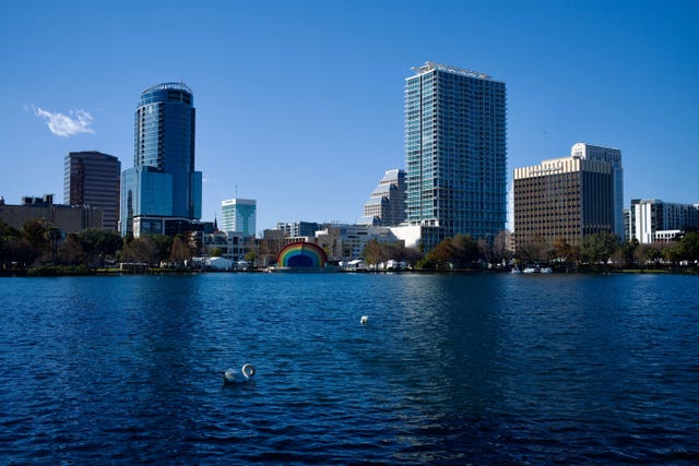 a body of water with buildings in the background