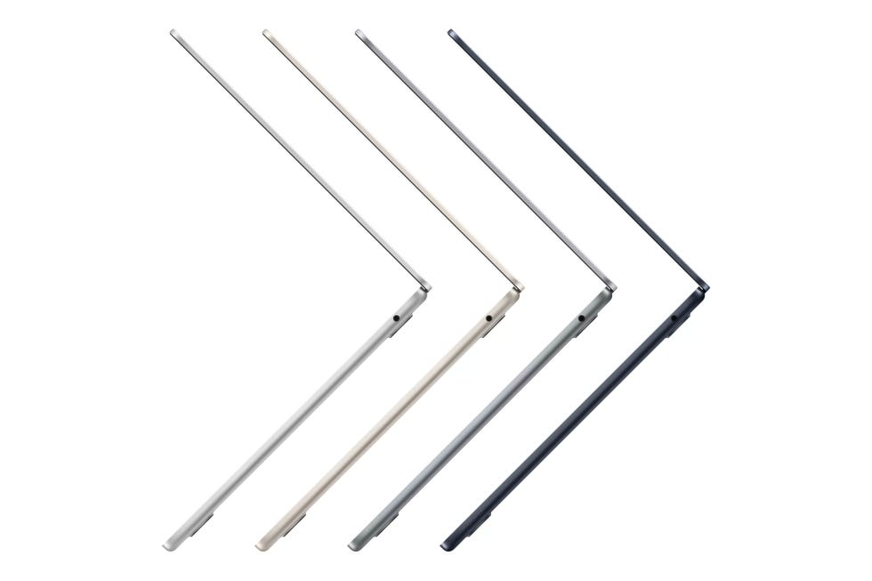 four sleek macbook air laptop devices arranged diagonally in different colors