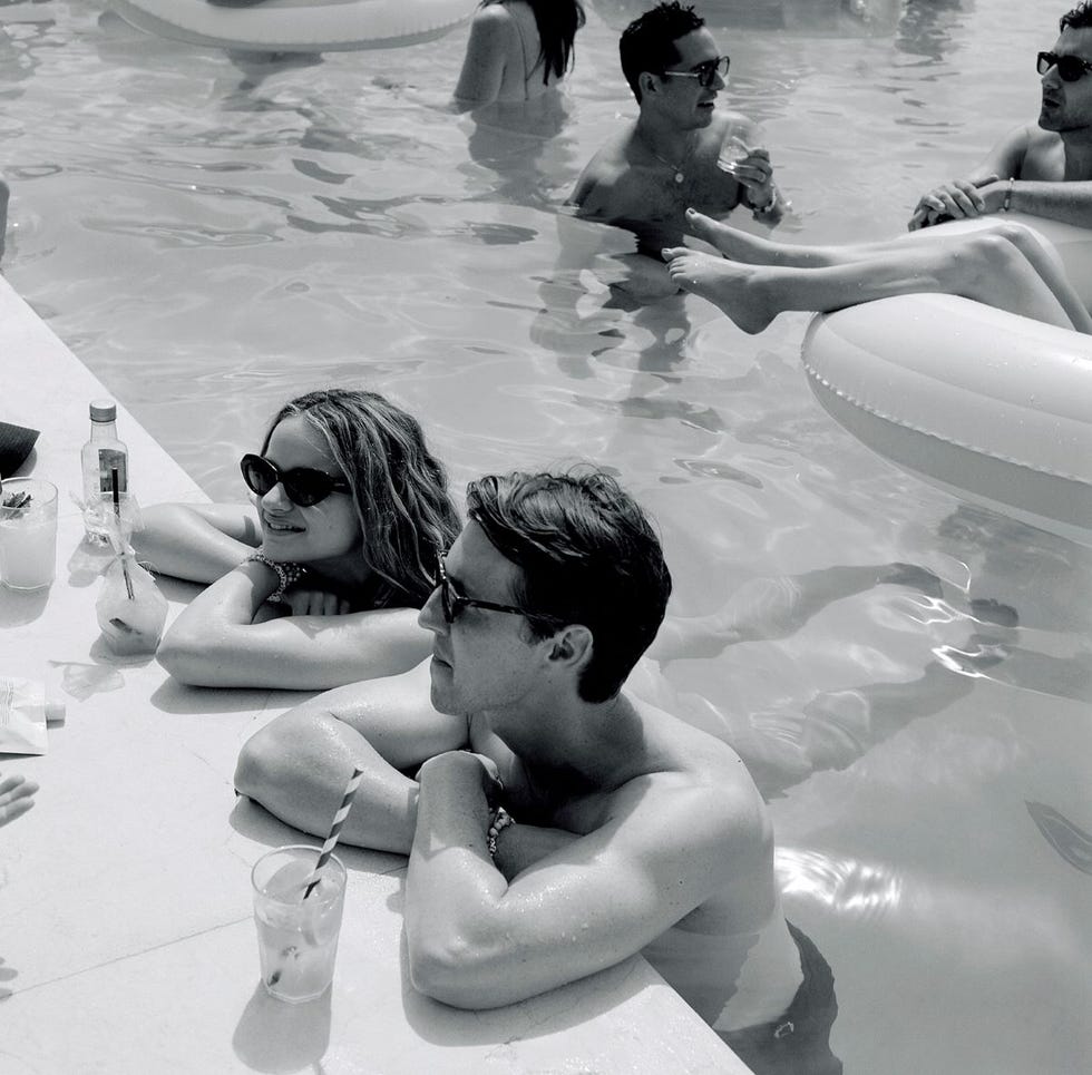 a man and woman in a pool